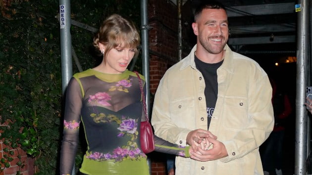 Taylor and Travis pack on the PDA; her version of “Out of the Woods” included in ‘Migration’ trailer