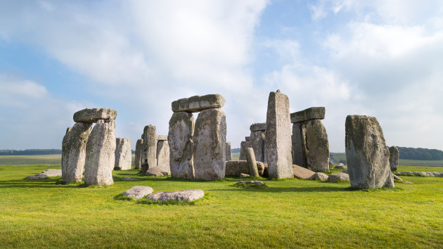 Environmental protesters spray orange material onto Britains Stonehenge