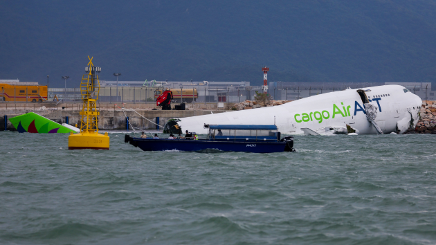 2 dead at Hong Kong International Airport after cargo plane skids off runway into the sea